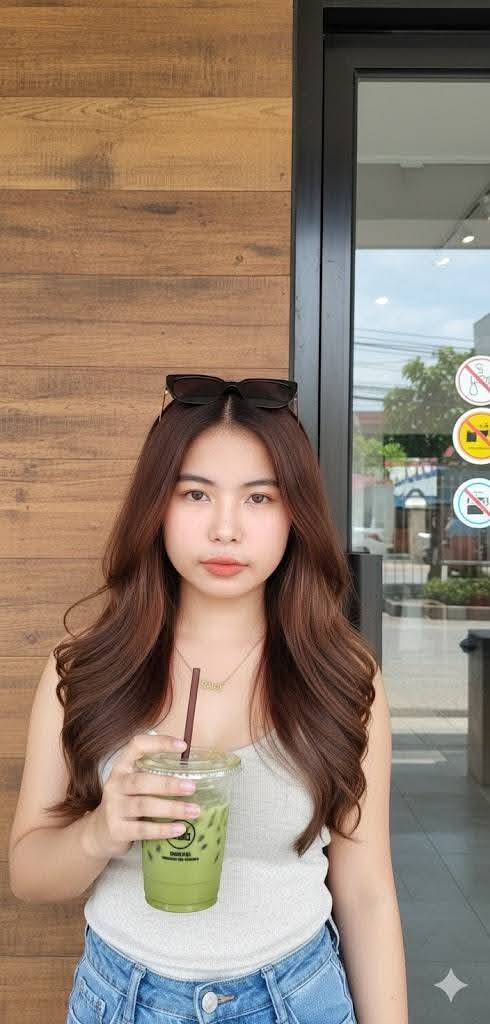 Holdimg a cup of Iced Green